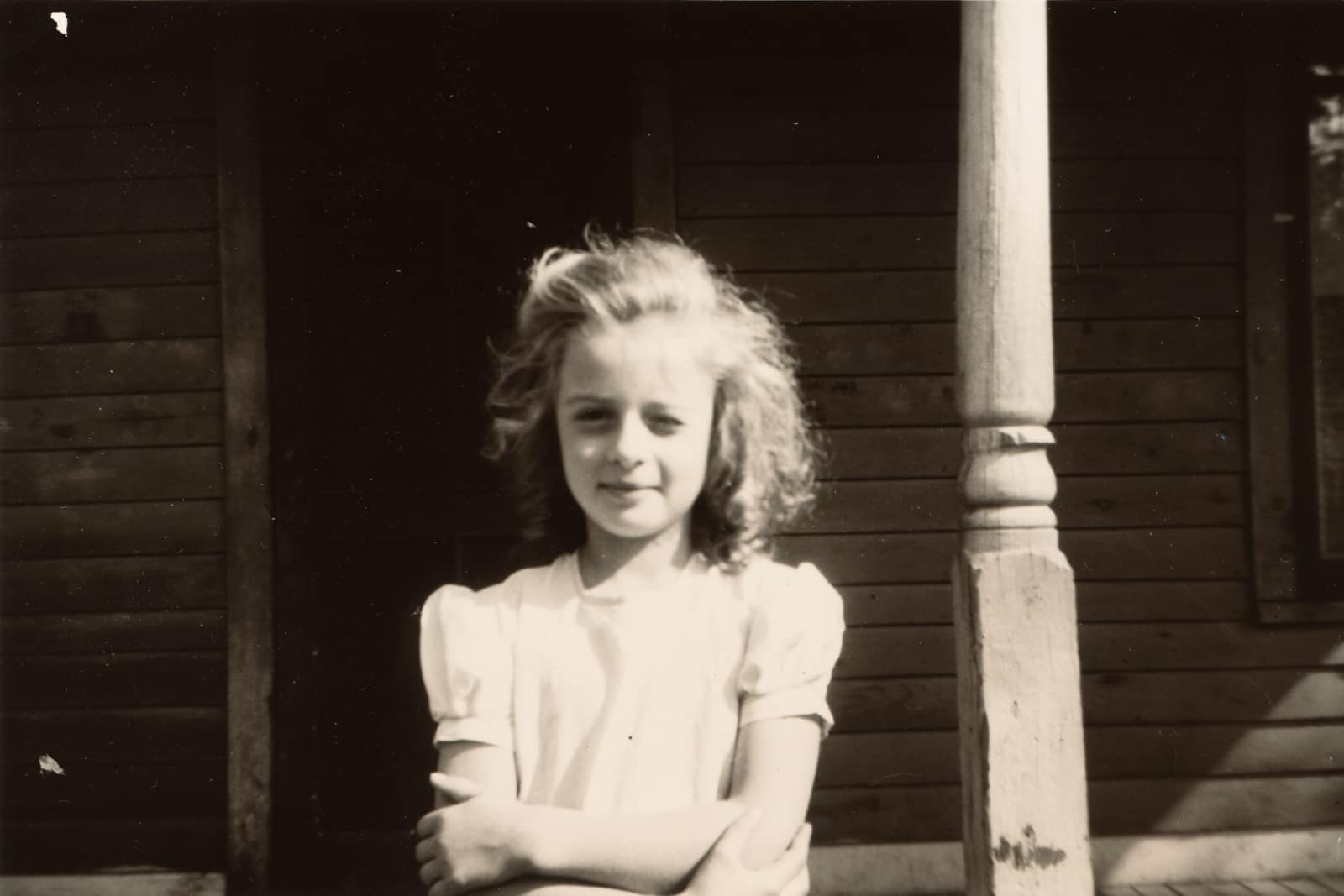 Bonnie J Ross, seated at home with a gentle smile.